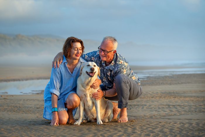 Family with pet at beach