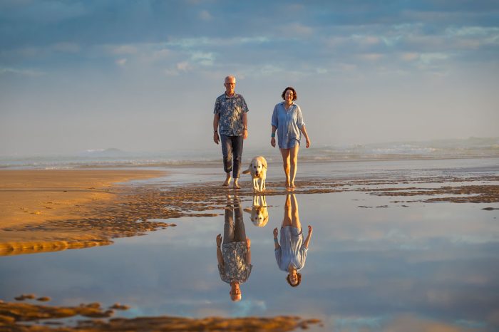 Family with pet at beach