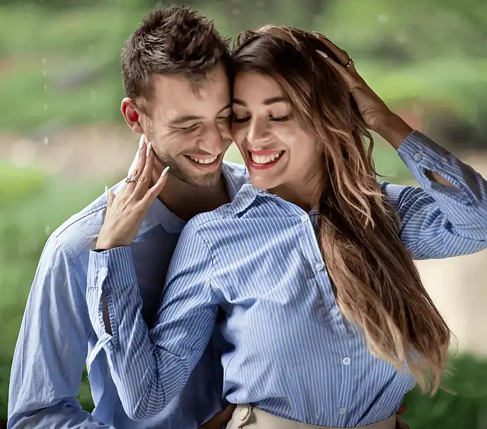 Happy couple smiling together during a romantic portrait photography session