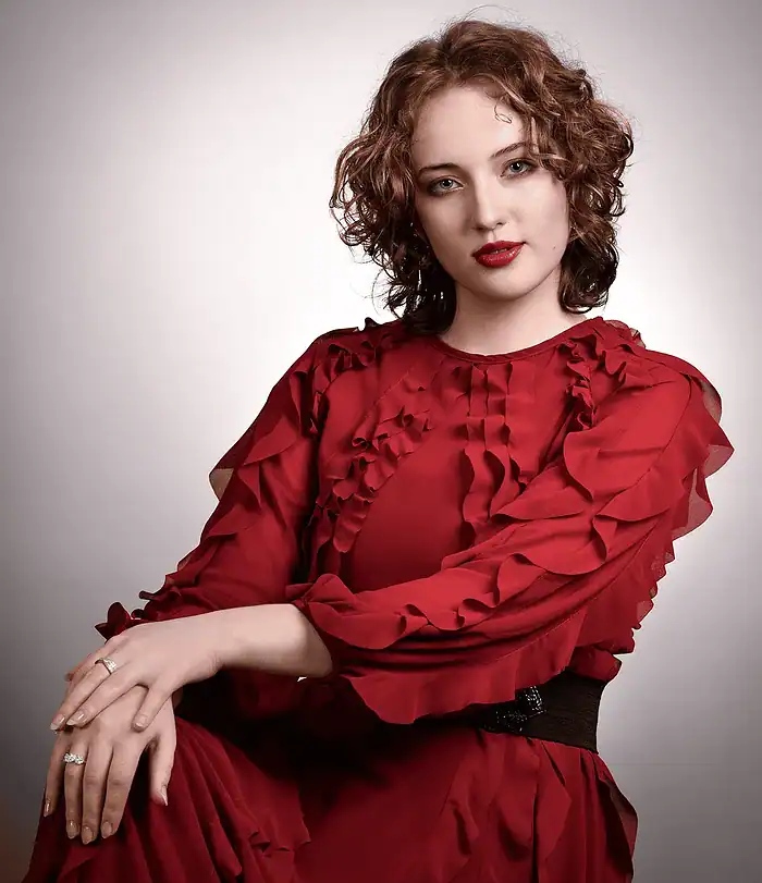 Elegant studio portrait of a woman in a refined and timeless portrait style