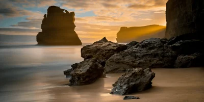 Sunset over Gibson Steps Beach Great Ocean Road Victoria Australia with warm light illuminating cliffs and shoreline fine art print