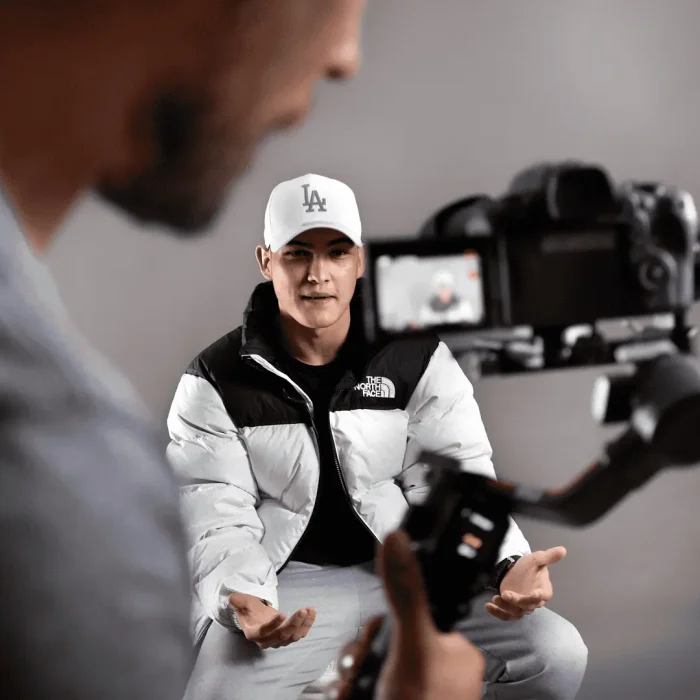 Commercial studio shoot of a rapper being filmed during a music video production