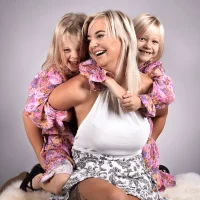 Mother smiling with her daughters