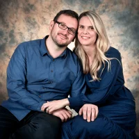 Happy parents smiling together in a studio