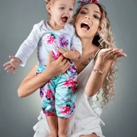 Mother and child happily posing in a studio