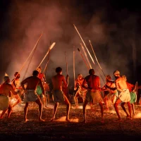 First Nations dancers performing around a fire in Cairns/Port Douglas