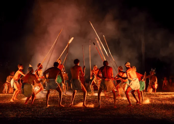 First Nations dancers performing around a fire in Cairns/Port Douglas